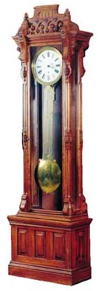 Walnut standing regulator with the typical Swiss pinwheel movement, 8 day, time only, weight driven. — Antique Clocks Price Guide