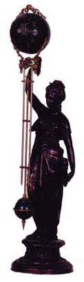 French style mystery clock, statue and ball, standing 30 1/2 inches high. — Antique Clocks Price Guide