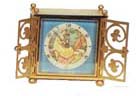 Swiss alarm clock, fancy brass case, double doors over the front, clock swivels in the case to access the back to wind and set hands. — Antique Clocks Price Guide