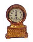 Jennings Bros. novelty clock in a rich Roman gold plated case that is 4 1/2 inches high. — Antique Clocks Price Guide