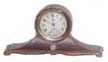Benedict Mfg. Co., movement by Waterbury Clock Co., tambour style bronze case is 7 inches wide, 3 1/2 inches high. — Antique Clocks Price Guide