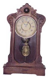 E. Ingraham Clock Co. walnut parlor. 8 day movement strikes on a cathedral gong. — Antique Clocks Price Guide