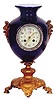 French clock in a blue cobalt urn, standing 15 inches high.