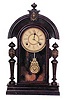 Ansonia Clock Co. "King", ca 1901. 22 inch black walnut case, never refinished or cleaned, metal lions head ornaments on the posts and a ladies bust on top.