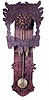 Early Black Forest clock made from two pieces of wood.