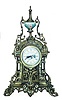 French bronze mantle clock. Matching hand painted dial and urn.