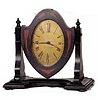 Seth Thomas "No. 2 Boudoir", ca 1928. A swinging frame clock of two tone mahogany, 9 1/2 inches wide, 9 1/4 inches high.