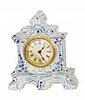 Ansonia Clock Co. blue delf porcelain case. Extra fancy with attached flowers and leaves on the front like the Meisen china clocks.
