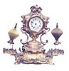 Inkwell novelty clock. Double glass inkwells with very fancy stoppers.