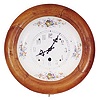 German porcelain plate dial clock with a wood bezel.