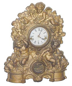 Mueller case with a metal front, Waterbury Clock Co. movement and full label. — Antique Clocks Price Guide