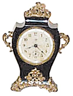 F. Kroeber Clock Co. New York, "Porcelene" enameled iron clock, specifically is called the "Josephine Alarm". — Antique Clocks Price Guide