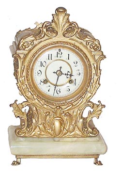 Waterbury Clock Co. metal cased clock on a green onyx base, ca 1906. — Antique Clocks Price Guide