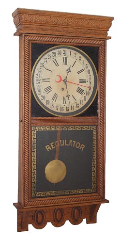 E. Ingraham Company hanging, "Northwestern", ca 1910, commonly called a store regulator. — Antique Clocks Price Guide