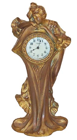 New Haven Clock Co. novelty clock. Called "Valetta" in the New Haven book and originally was available with two vases. — Antique Clocks Price Guide