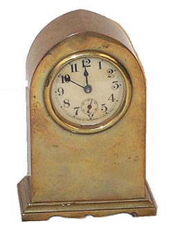 Waterbury Clock Co. novelty called the "Amon", ca 1912. Smallbrass case is 5 inches high, 2 inch celluloid dial with seconds dial. — Antique Clocks Price Guide