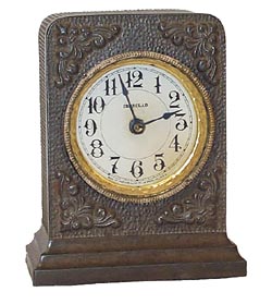Western Clock Co. "Westclox-Ironclad". 5 inch high metal case, clean dial, dial ring, and sash. — Antique Clocks Price Guide