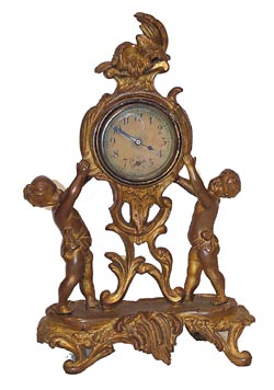 New Haven Clock Co. novelty, "Bellona", ca 1906. 10 inch gold gilt case, now with hardly any gilt, down to the undercoat. — Antique Clocks Price Guide