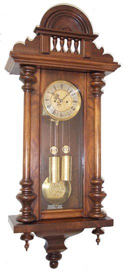 Miniature Vienna 2 weight with embossed weights, pendulum, and dial center. — Antique Clocks Price Guide