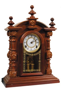 E. N. Welch Clock Co. "Patti No. 1". A contemporary clock made with the identical finials and turned columns on 4 corners as the very collectable original clocks. — Antique Clocks Price Guide