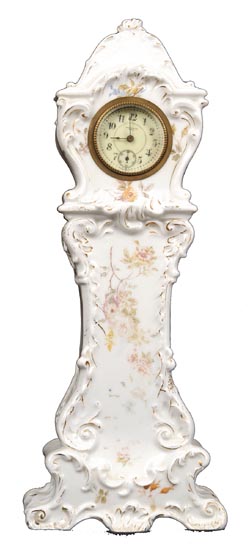 New Haven Clock Co., miniature porcelain grandfather clock. — Antique Clocks Price Guide