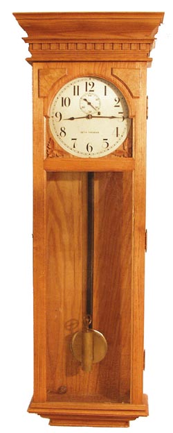 Seth Thomas contemporary regulator, identical to No. 40 in our Jan. 2003 auction, except this one is oak. — Antique Clocks Price Guide