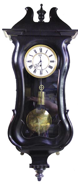 Serpentine Vienna, three quarter size, 39" high, 16.5" wide. — Antique Clocks Price Guide