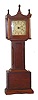 Miniature grandfather clock made by the Burroughs Company.