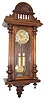 Miniature Vienna 2 weight with embossed weights, pendulum, and dial center.