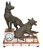 French Figural Clock featuring two nicely detailed spelter statues of German Shepherd dogs, one reclining and one standing.