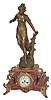 French statue on marble base. Cast bronze ornaments on the base, including the 4 elaborate feet and the large dial surround.