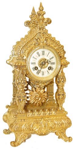 French solid cast brass, open well shelf clock. Cathedral style top, decorative roof, 4 columns, all resting on the footed base. — Antique Clocks Price Guide