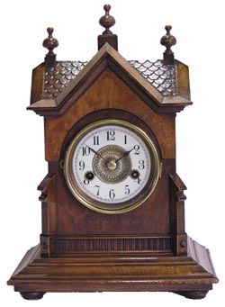 Hamburg American walnut bracket clock in a fancy little case with shingled roof and a gable in front like a German or Swiss chalet. — Antique Clocks Price Guide