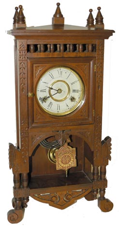 New Haven Clock Co. walnut cabinet clock, "Adige", C. 1886. — Antique Clocks Price Guide