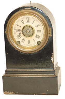 Terry Clock Co. enameled iron case, 8" high. 30 hour, time, strike, and alarm. — Antique Clocks Price Guide