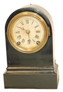 Terry Clock Co. enameled iron case, 8" high. 30 hour, time and strike. — Antique Clocks Price Guide