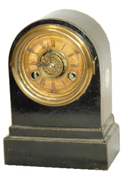 Terry Clock Co. enameled iron case, 6" high. 30 hour, time and alarm. — Antique Clocks Price Guide
