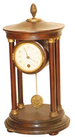 Hamburg-American Clock Co. novelty shelf clock, like an empire with the 4 columns holding up the roof over the movement. — Antique Clocks Price Guide