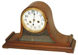 Waterbury Clock Co. tambour, a rare model, "Loirol", with a porcelain dial and a beveled glass below the dial that allows you to watch the pendulum. Full black label on the base, and a factory sticker, "9492". — Antique Clocks Price Guide