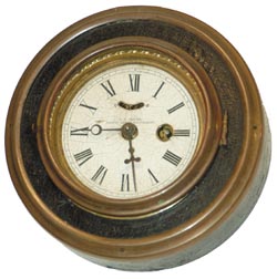 S. B. Jerome, 6.5" round gallery, very similar to #319, but round leatherette case, no buttons, no fancy brass trim around the edge, just a brass band similar to the bezel. — Antique Clocks Price Guide