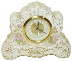 "Made In Germany", miniature porcelain clock, 6" wide, 4.25" high. — Antique Clocks Price Guide