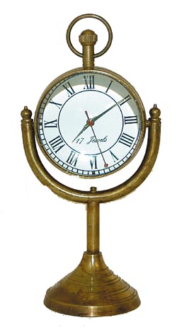 Glass Ball novelty clock attached to a stand. — Antique Clocks Price Guide