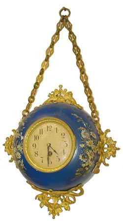 Austrian hanging cartel, metal case, heavy brass ornaments, and hand painted flowers on a blue painted metal case. C. 1900. — Antique Clocks Price Guide