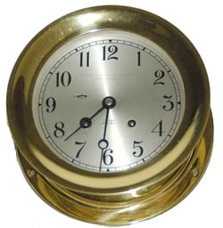 Chelsea Ships Bell clock in a polished brass case, 7.25" across the bezel, and 7.5" across the base. — Antique Clocks Price Guide