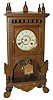 New Haven Clock Co. walnut cabinet clock, "Adige", C. 1886.
