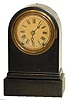 Terry Clock Co. iron cased clock. This model is 8" high, round top, one day, time and strike.
