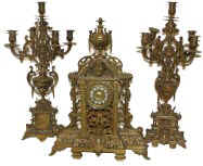 It may not look like much, but it weights more than 2 strong men can carry, and it is all bronze. French 3 piece set, side pieces are 28 inches high, clock 26 inches high. 8 day French movement, bell strike, running. — Antique Clocks Price Guide