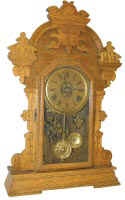 Seth Thomas oak mantle clock, perhaps one of the Exposition Series as it is almost 25 inches high and has many features of that series. — Antique Clocks Price Guide