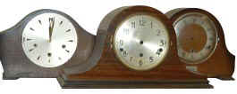 3 clocks, L to R. — Antique Clocks Price Guide