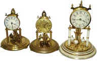 Three 400 day clocks, all with domes. — Antique Clocks Price Guide